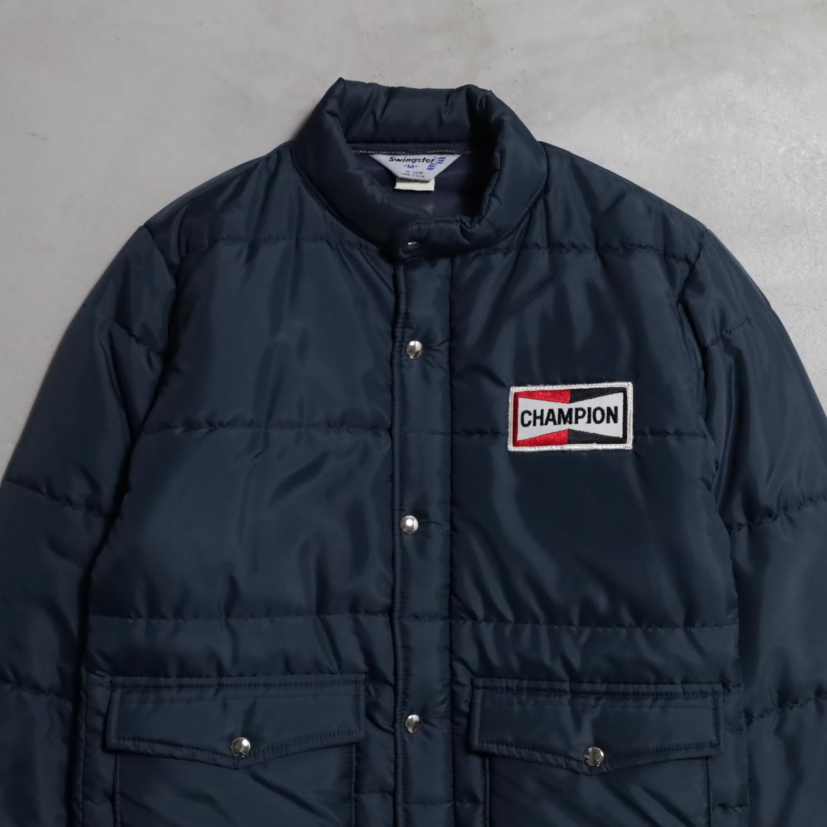 CHAMPION SPARK PLUGS RACING PUFF JACKET (MEDIUM/GOOD CONDITION)